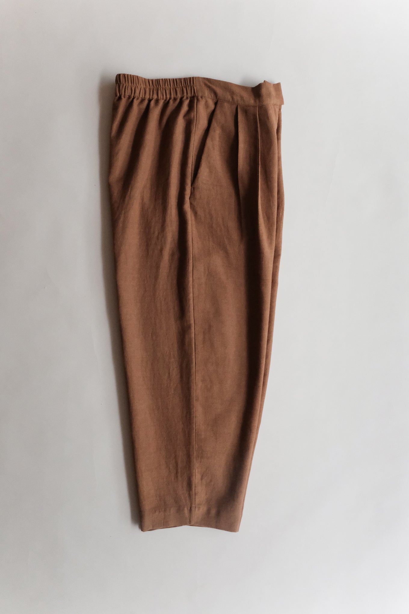 Runaway Bicycle Paul pant in handloom cotton in rust.