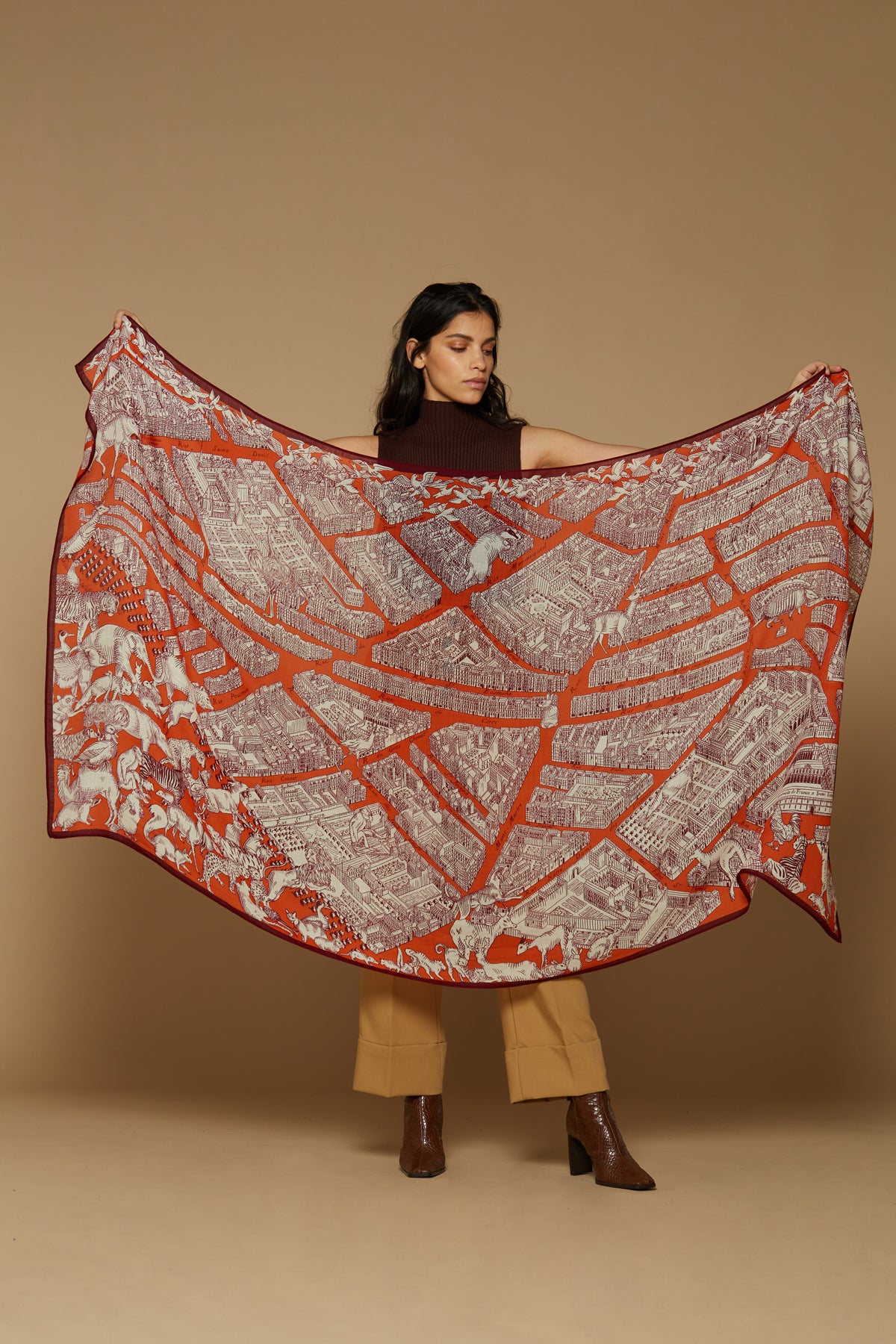 Inoui Editions pure wool scarf Turgot map of Paris with animals surrounding on orange background.