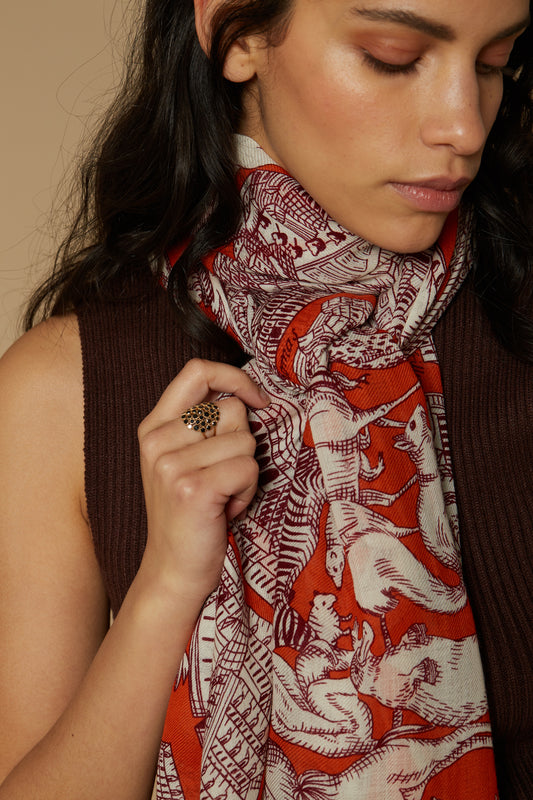 Inoui Editions pure wool scarf Turgot map of Paris with animals surrounding on orange background.