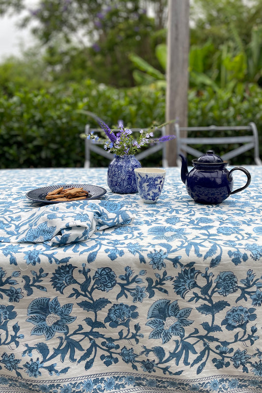 Cotton tablecloth, blockprinted by hand exclusively for Juniper Hearth, Mina floral in shades of denim blue on white.