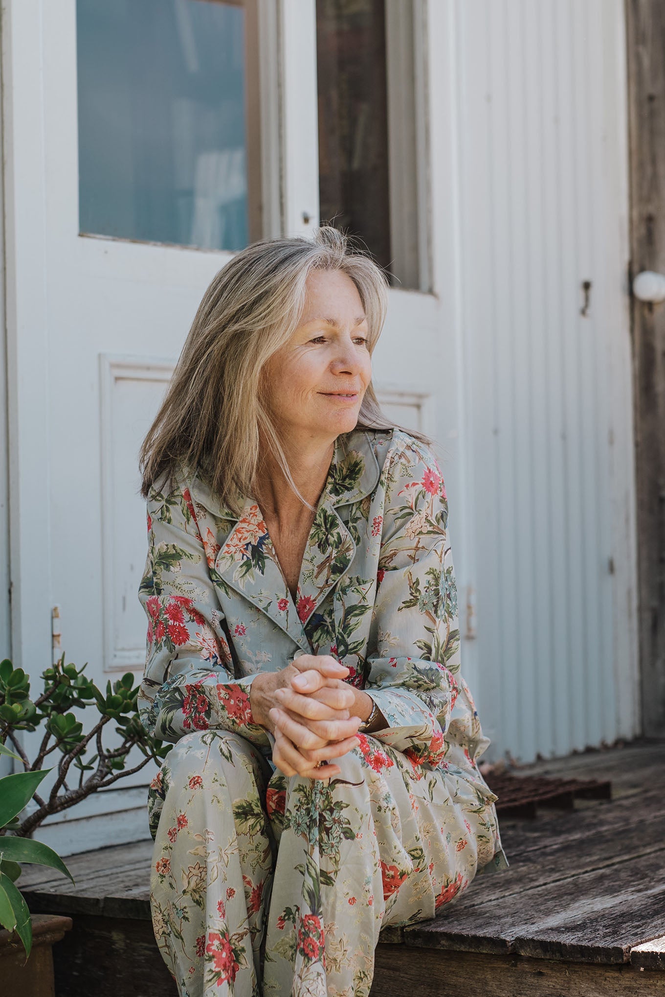 Juniper Hearth cotton voile pyjamas in Country Garden, floral print in rose pink, sage and aqua on soft blue green background.