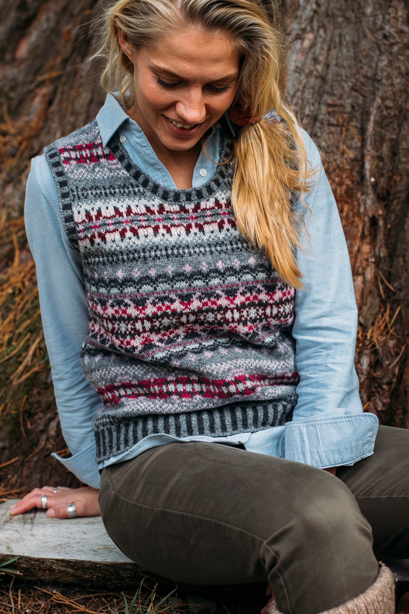 Eribe Westray Shetland wool fairisle vest in Tokyo, shades of grey with magenta, burgundy and pink.