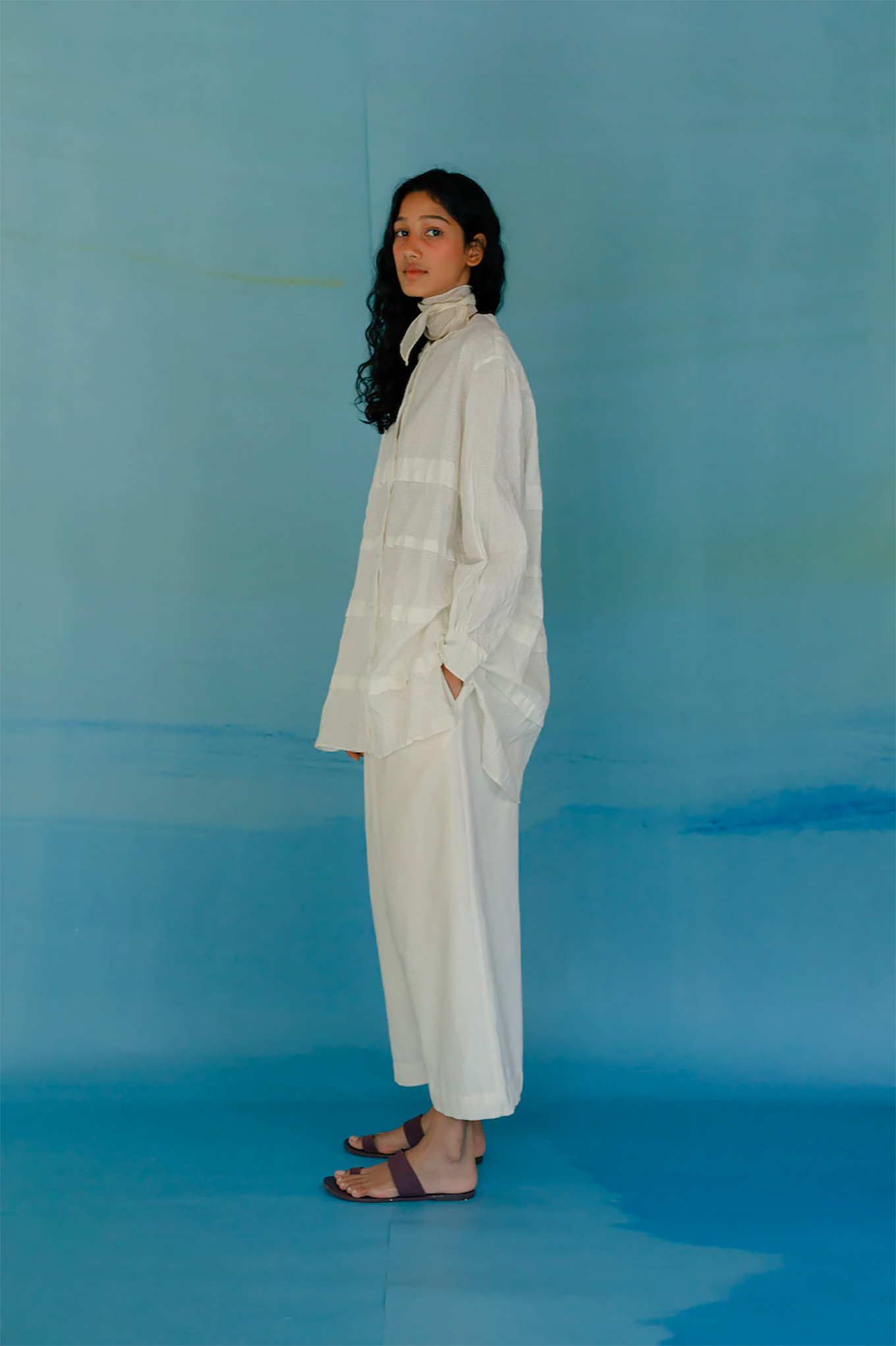 Runaway Bicycle Eda shirt, loose fit long sleeve shirt in white handloom cotton with horizontal tuck detailing.