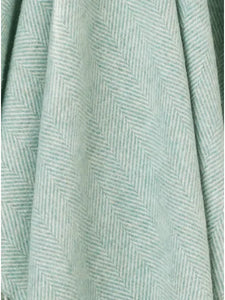 Bronte by Moon Herringbone throw in eucalyptus soft blue green merino wool. Made in England.
