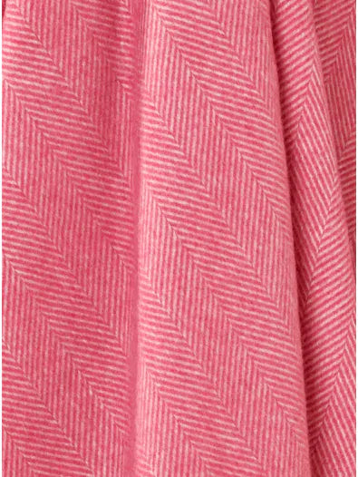 Bronte by Moon Herringbone throw in cerise pink merino wool. Made in England.
