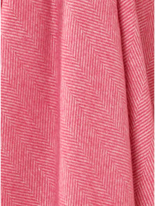 Bronte by Moon Herringbone throw in cerise pink merino wool. Made in England.