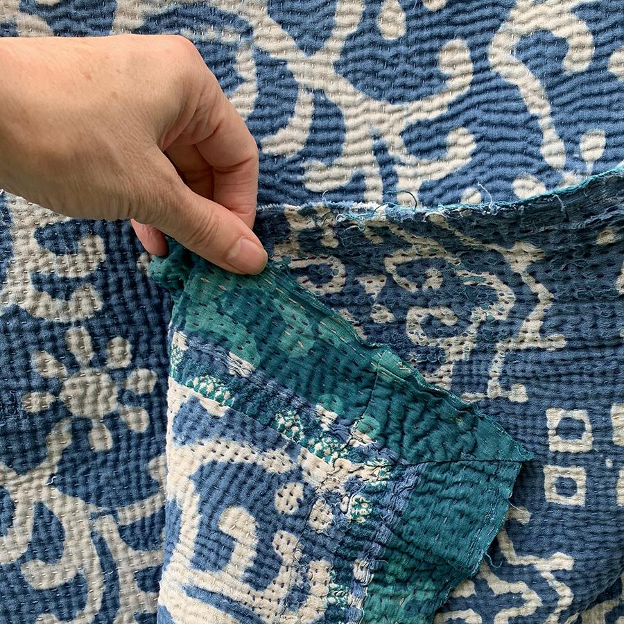 Vintage indigo block print blue and white kantha quilt with green border