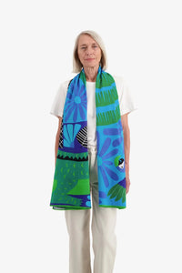 Inoui Editions Mangrovecolourful tropical scene on cotton scarf in blue and emerald.