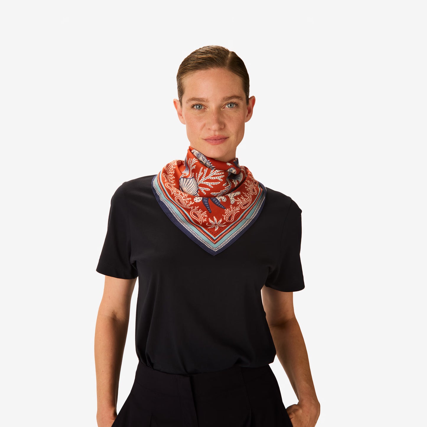 Inoui Editions Neptune pure silk carre, terracotta, blue and white scarf with marine life design on a white background.