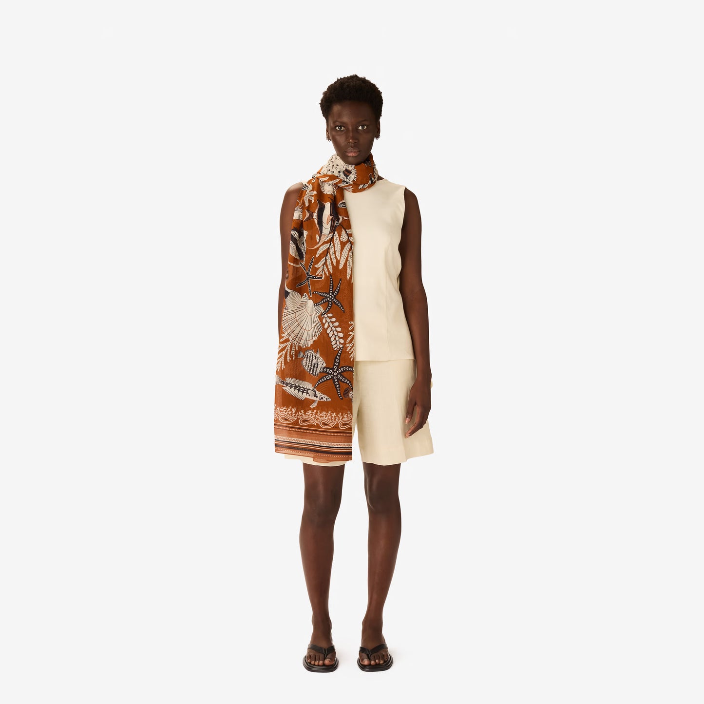 Inoui Editions Neptune Golden brown pure cotton scarf tan background with fish and underwater creatures.