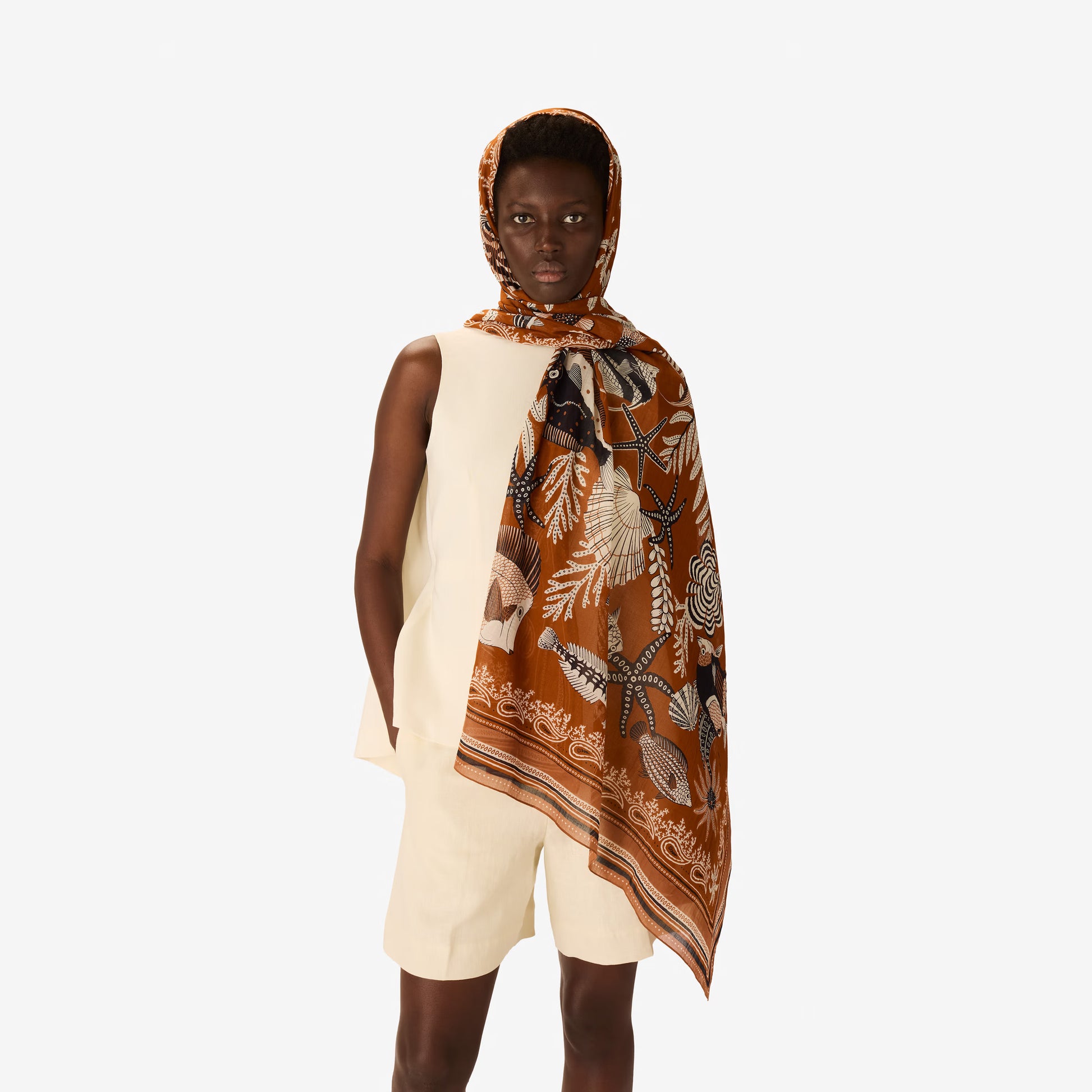 Inoui Editions Neptune Golden brown pure cotton scarf tan background with fish and underwater creatures.