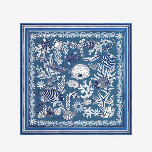 Inoui Editions Neptune pure silk carre, blue and white scarf with marine life design on a white background.