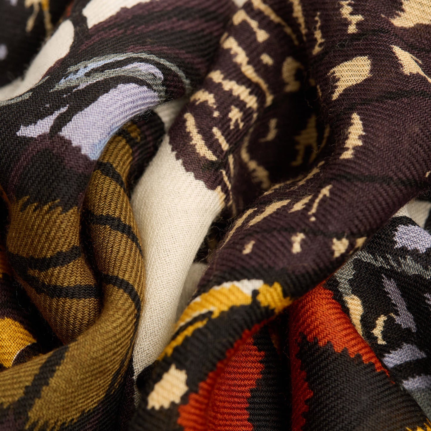 Inoui Editions fine wool scarf Papillons featuring colorful butterfly illustrations on a white background.