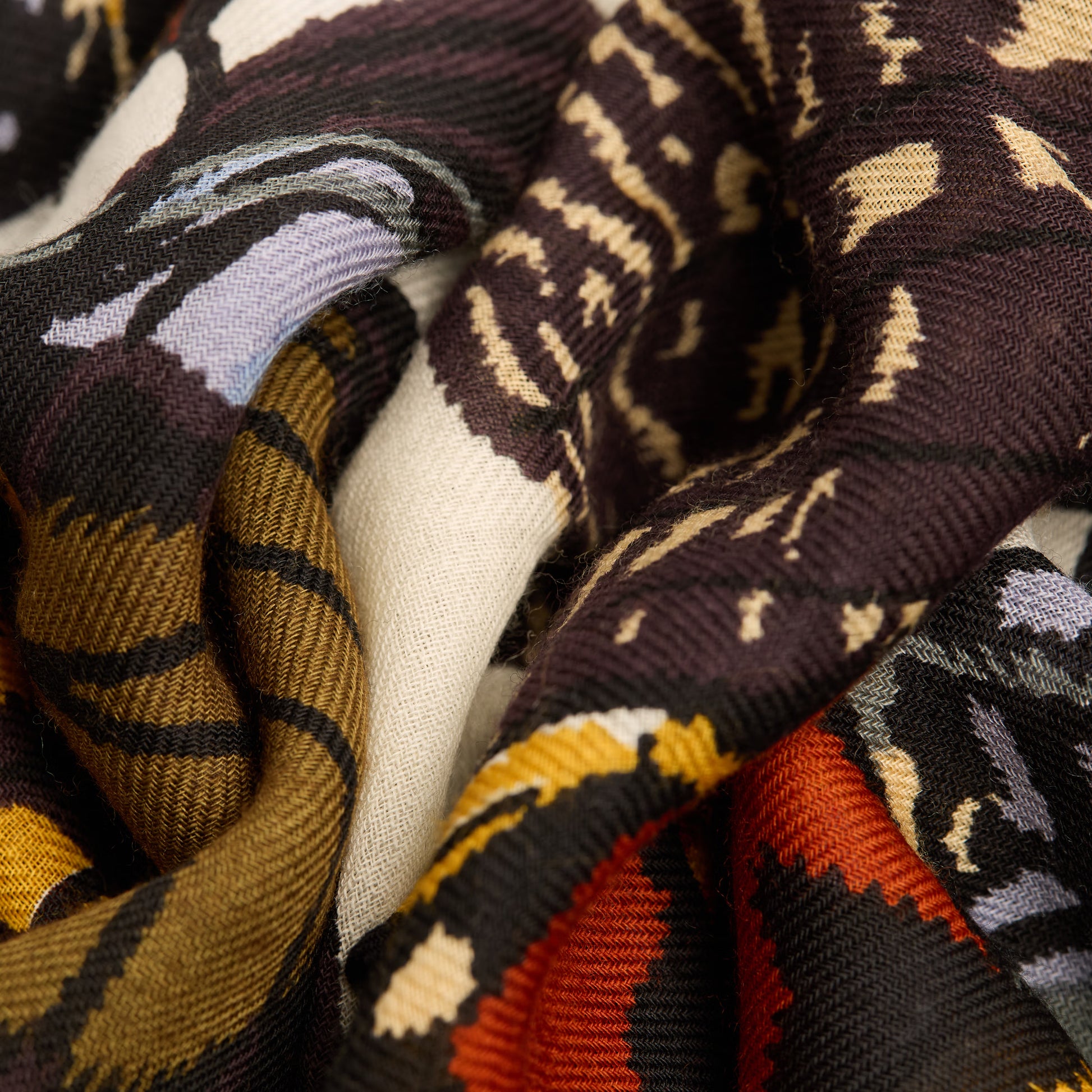 Inoui Editions fine wool scarf Papillons featuring colorful butterfly illustrations on a white background.