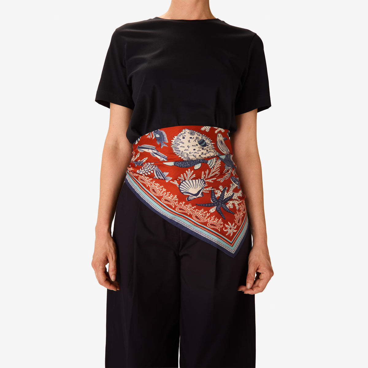 Inoui Editions Neptune pure silk carre, terracotta, blue and white scarf with marine life design on a white background.