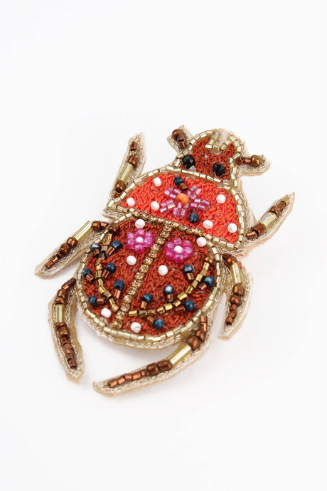 My Doris Autumn beetle handbeaded brooch.