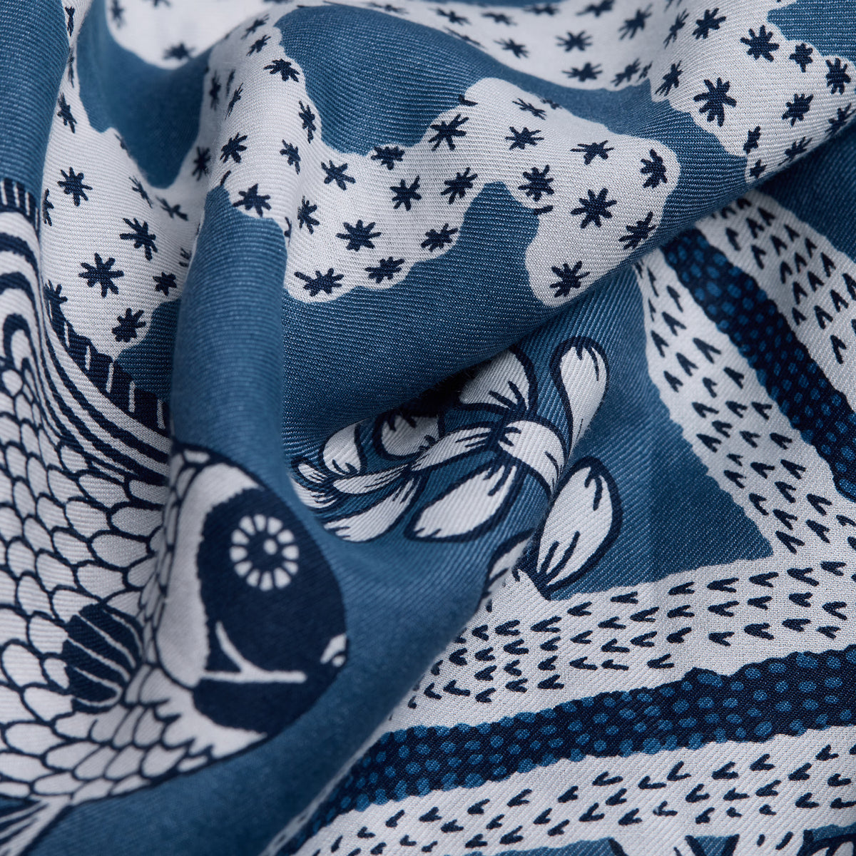 Inoui Editions Neptune pure silk carre, blue and white scarf with marine life design on a white background.