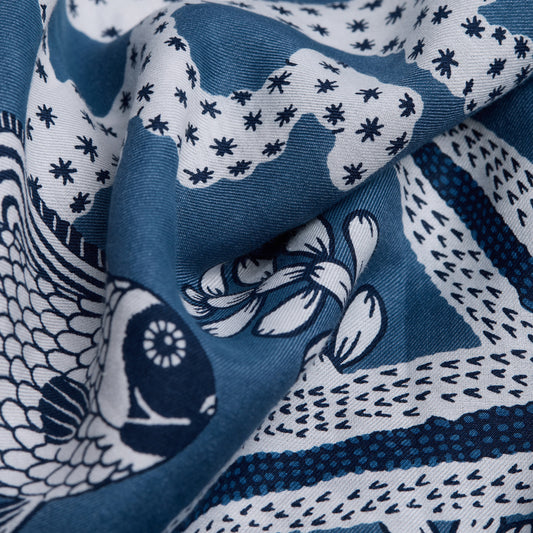 Inoui Editions Neptune pure silk carre, blue and white scarf with marine life design on a white background.