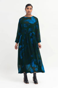 Elk Gira Sheer Dress long-sleeved crew neck dress with a set-in sleeve and dropped shoulder, gathered at waist seam.
