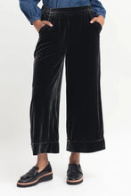 Load image into Gallery viewer, Elk Metti Velvet Pant in charcoal, wide leg with faux cuff, side and back pockets, elastic at the back of the waistband.