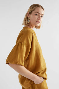 Elk Strom linen top with puff gathered sleeve in honey gold mustard yellow.