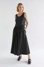 Load image into Gallery viewer, Elk the Label Elev pull on elastic waist midi length skirt in black linen.