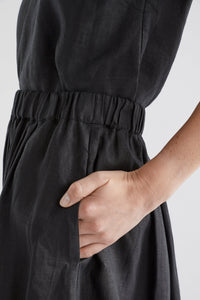 Elk the Label Elev pull on elastic waist midi length skirt in black linen.