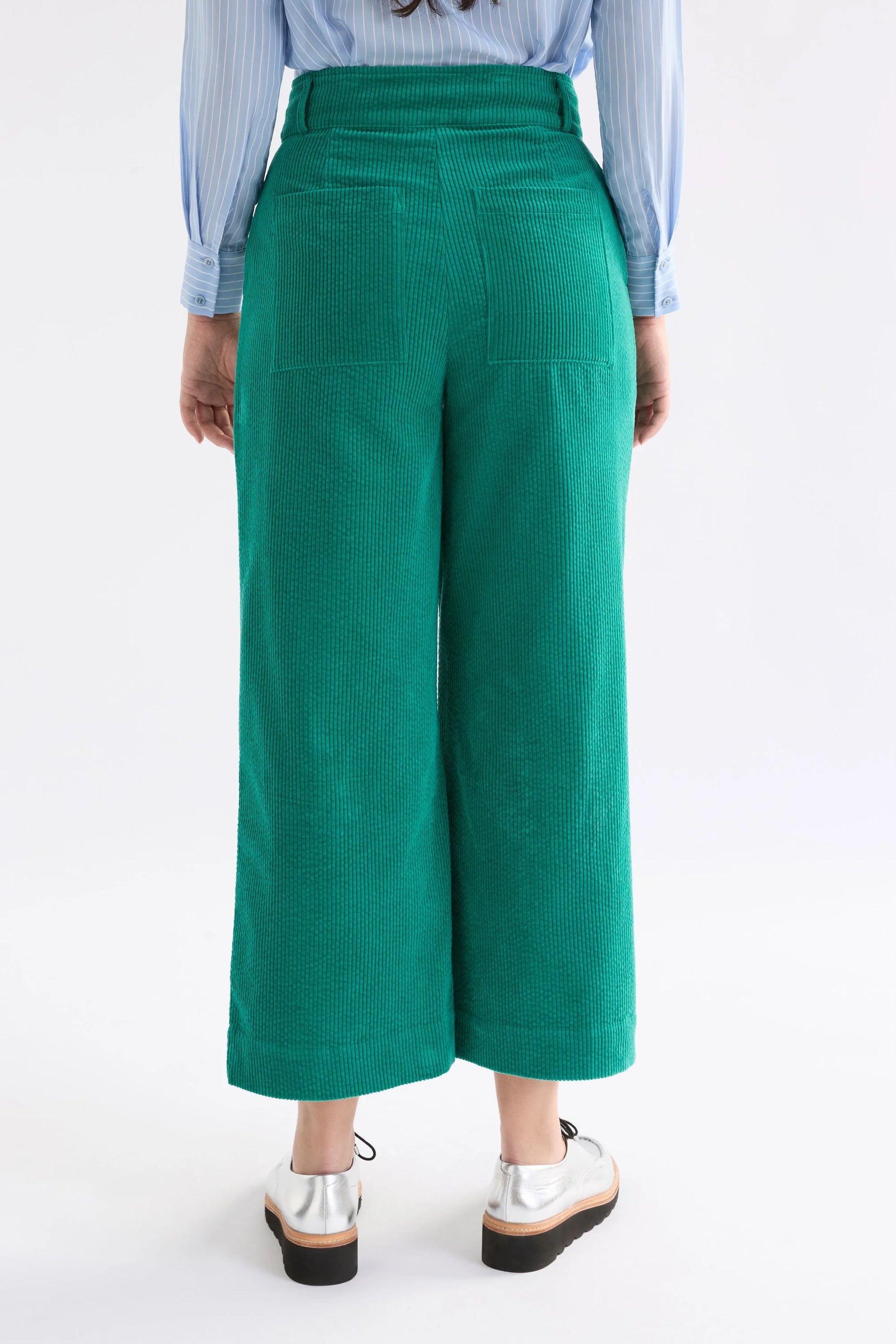 Elk Rhes organic cotton corduroy wide leg pants in island green.