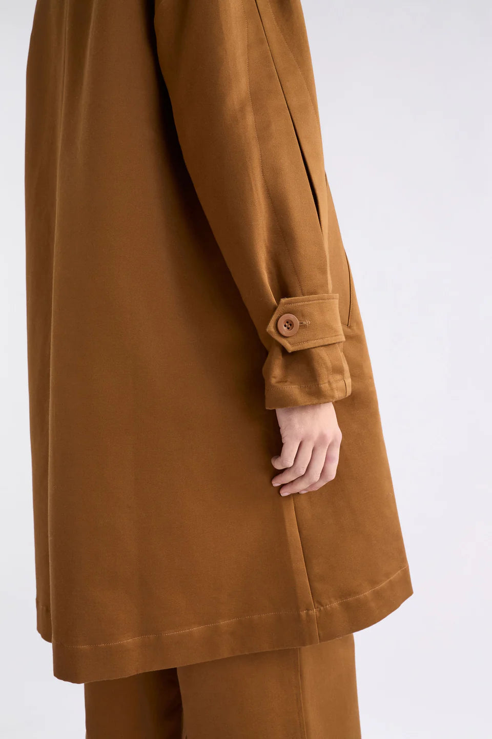 Elk Talli organic cotton coat in cinnamon brown.