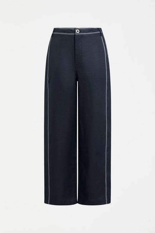 Elk Sonnen French linen pants, midnight navy with white top stitching.