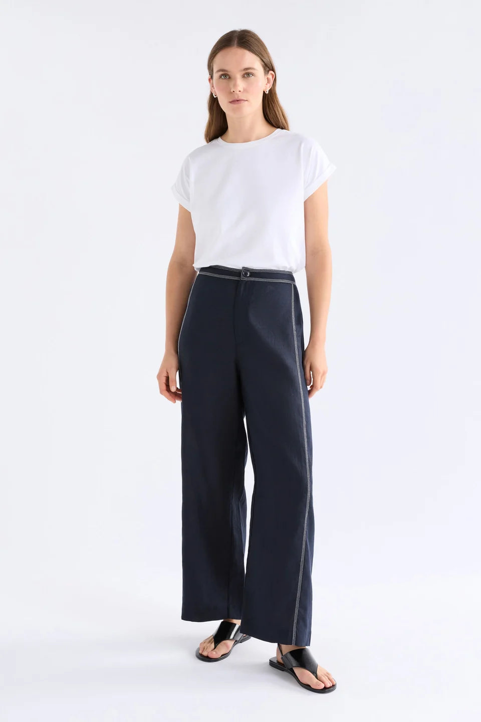 Elk Sonnen French linen pants, midnight navy with white top stitching.