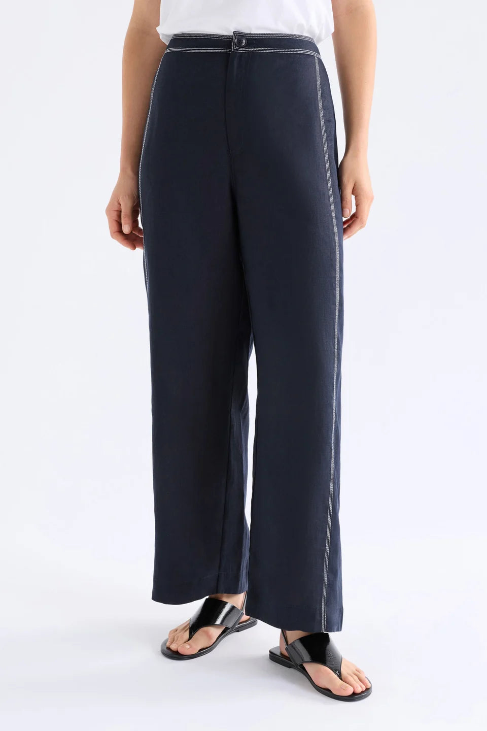Elk Sonnen French linen pants, midnight navy with white top stitching.