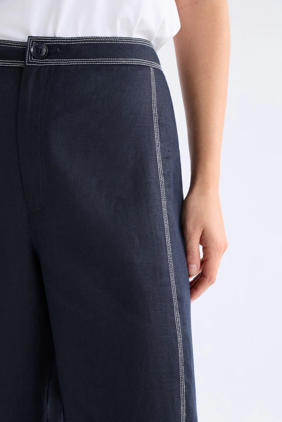 Elk Sonnen French linen pants, midnight navy with white top stitching.