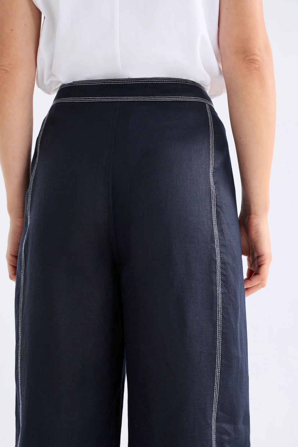 Elk Sonnen French linen pants, midnight navy with white top stitching.