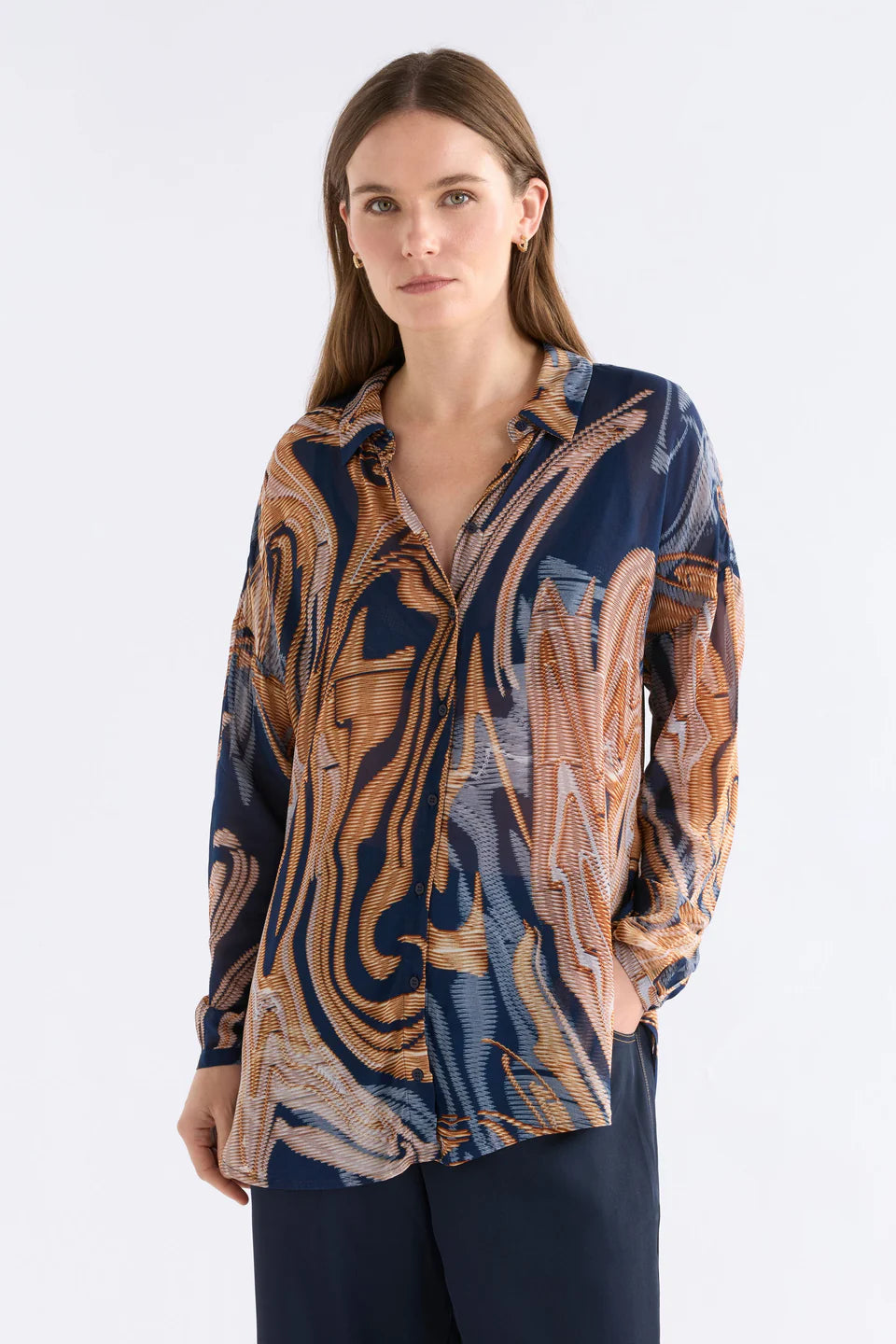 Elk Eir shirt in abstract neutrals print on navy base.