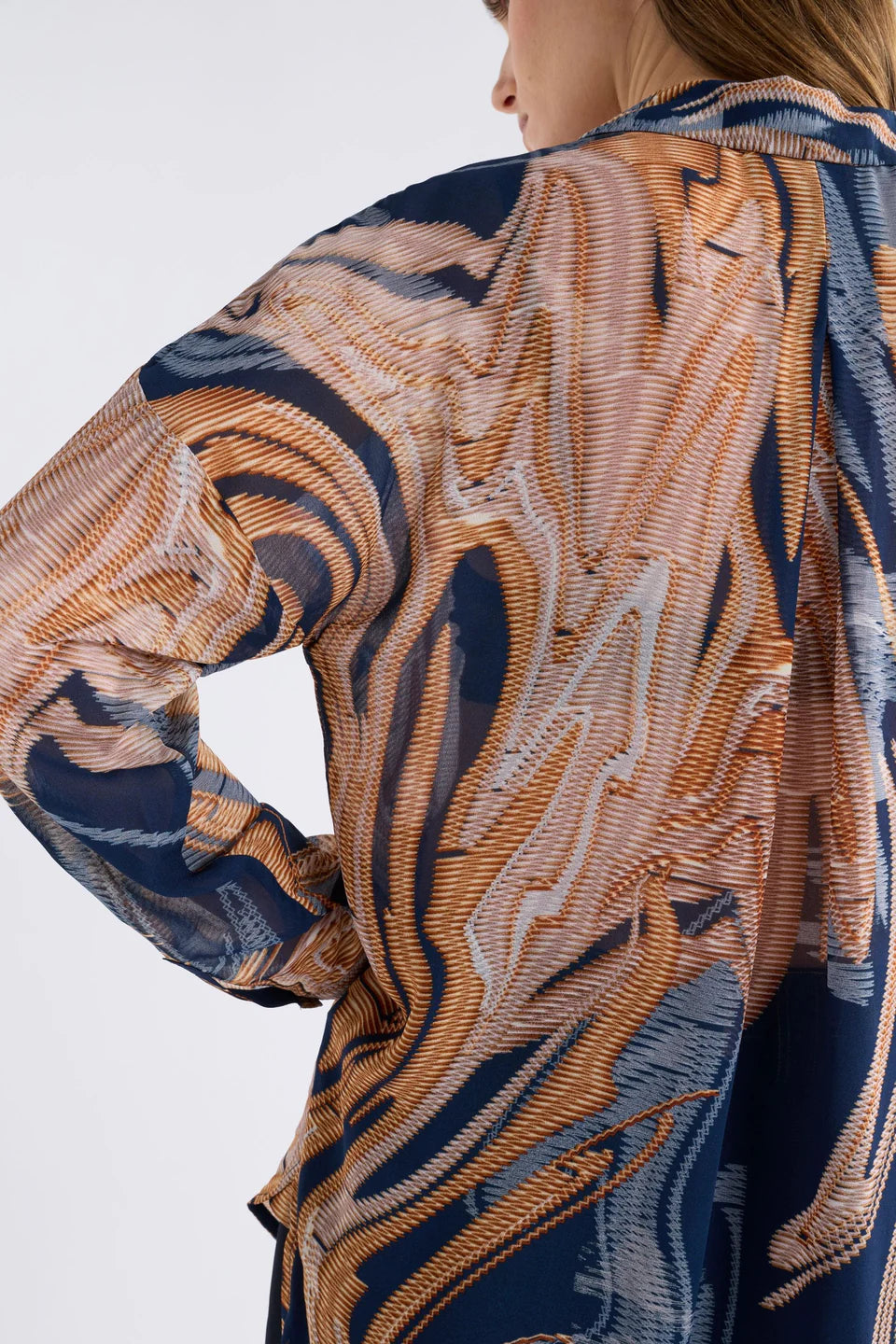 Elk Eir shirt in abstract neutrals print on navy base.