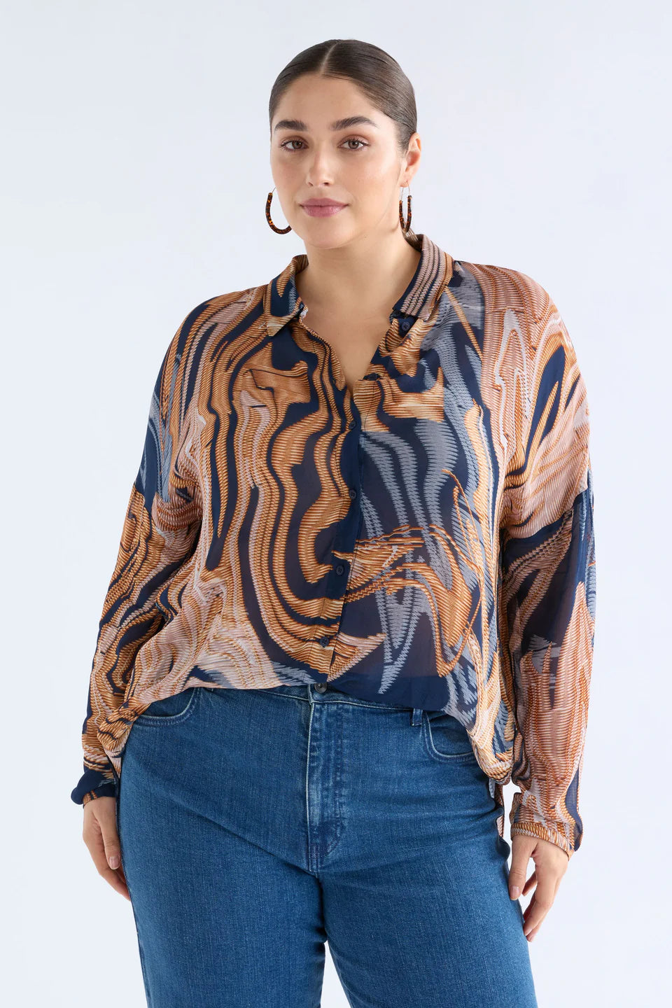 Elk Eir shirt in abstract neutrals print on navy base.