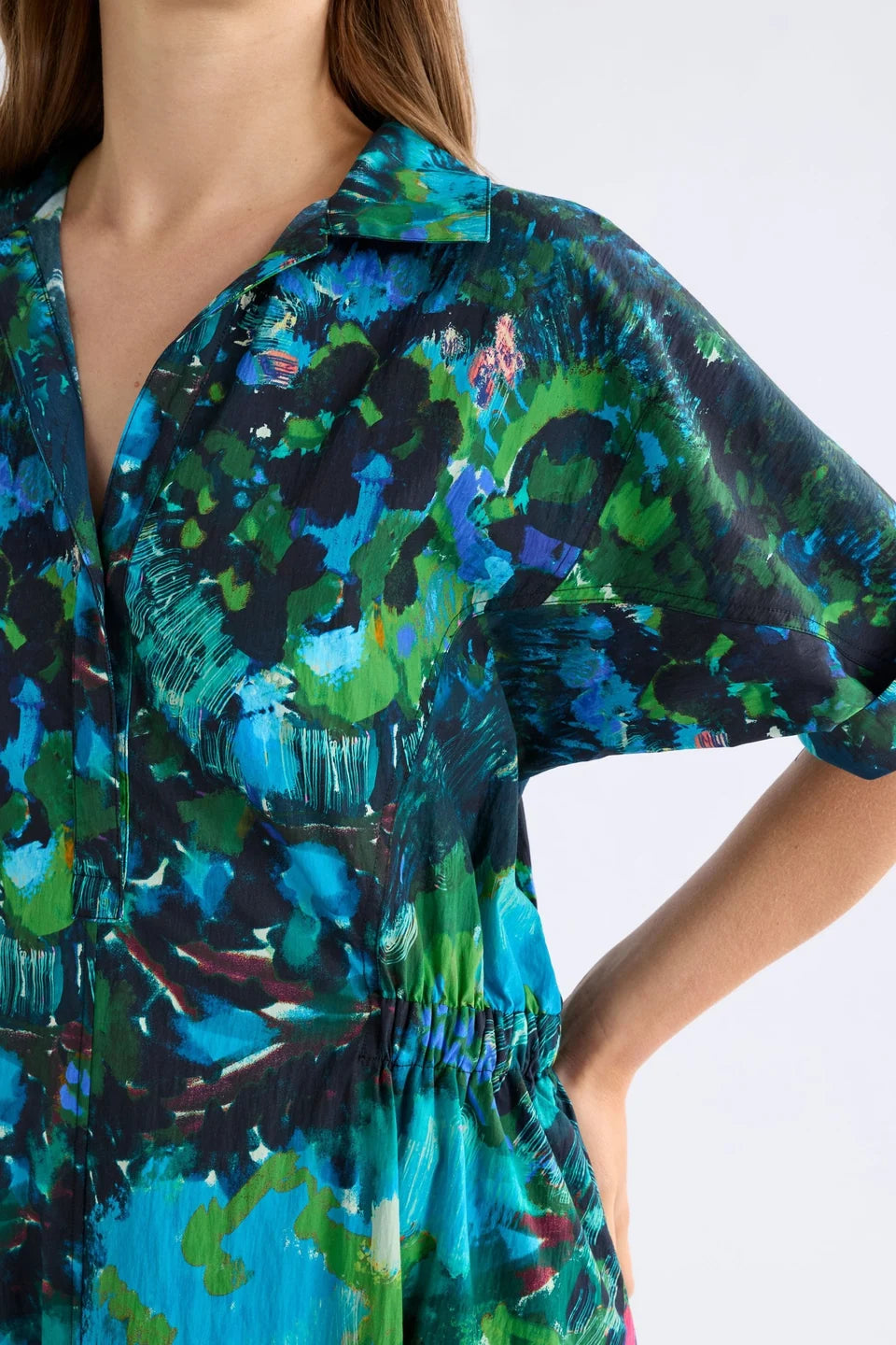 Elk Bohn shirt dress short-sleeve collared with a vibrant abstract floral print in shades of teal, green, blue, and black.