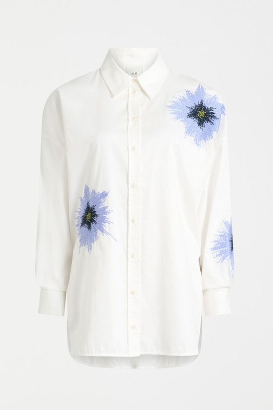 Elk Eiren relaxed white cotton poplin shirt with embroidered blue floral motifs.