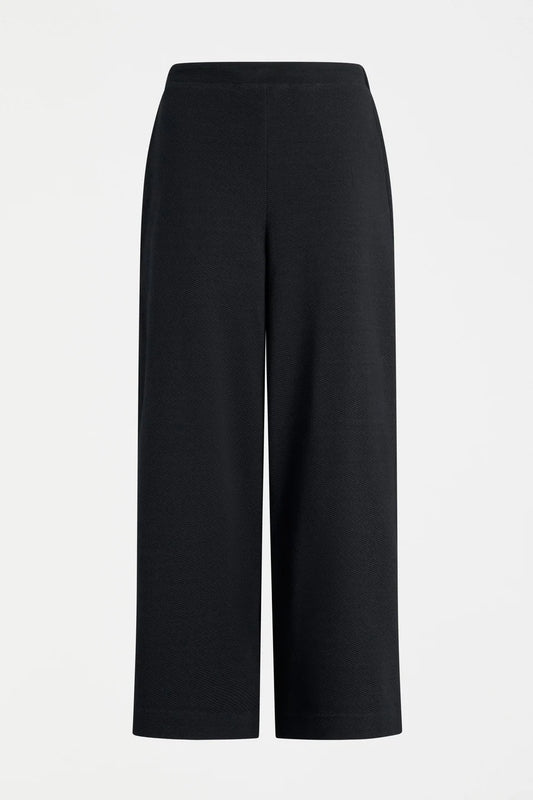 Elk Sanna pant, black wide-leg full length pants shown in textured organic cotton jersey.