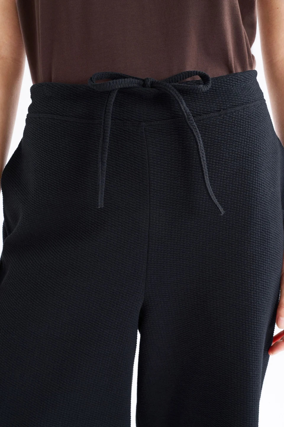 Elk Sanna pant, black wide-leg full length pants shown in textured organic cotton jersey.