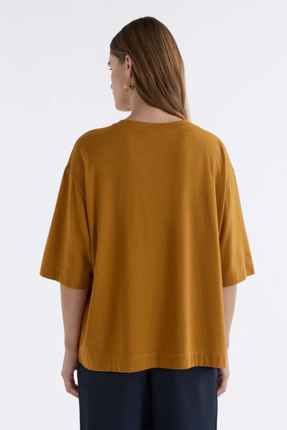 Elk Tiel tshirt in gold, mustard yellow short-sleeve crewneck in organic cotton / modal blend.