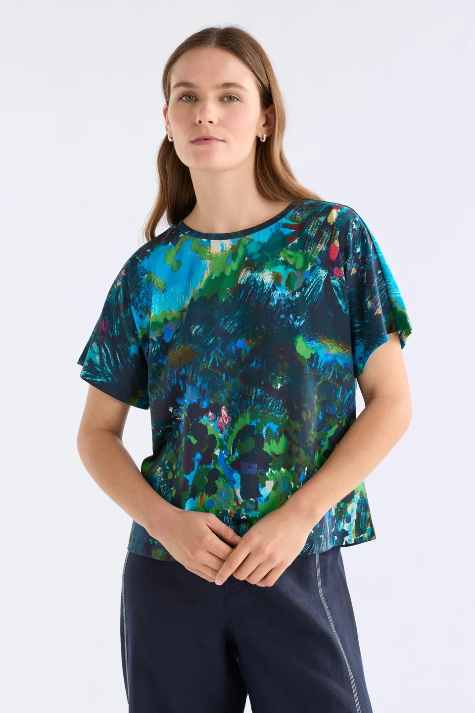 ELk Haki short sleeve print t-shirt in blue, green, and pink abstract.