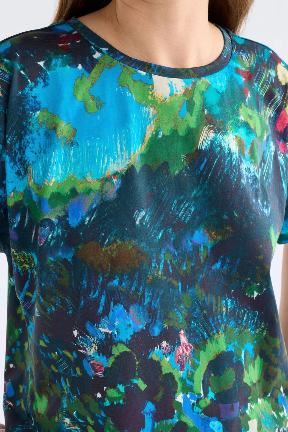 ELk Haki short sleeve print t-shirt in blue, green, and pink abstract.