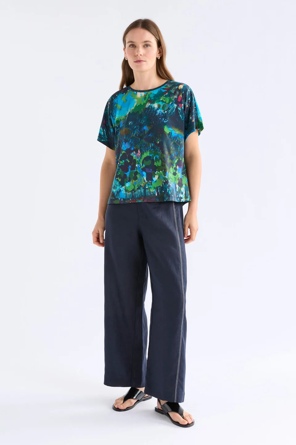ELk Haki short sleeve print t-shirt in blue, green, and pink abstract.