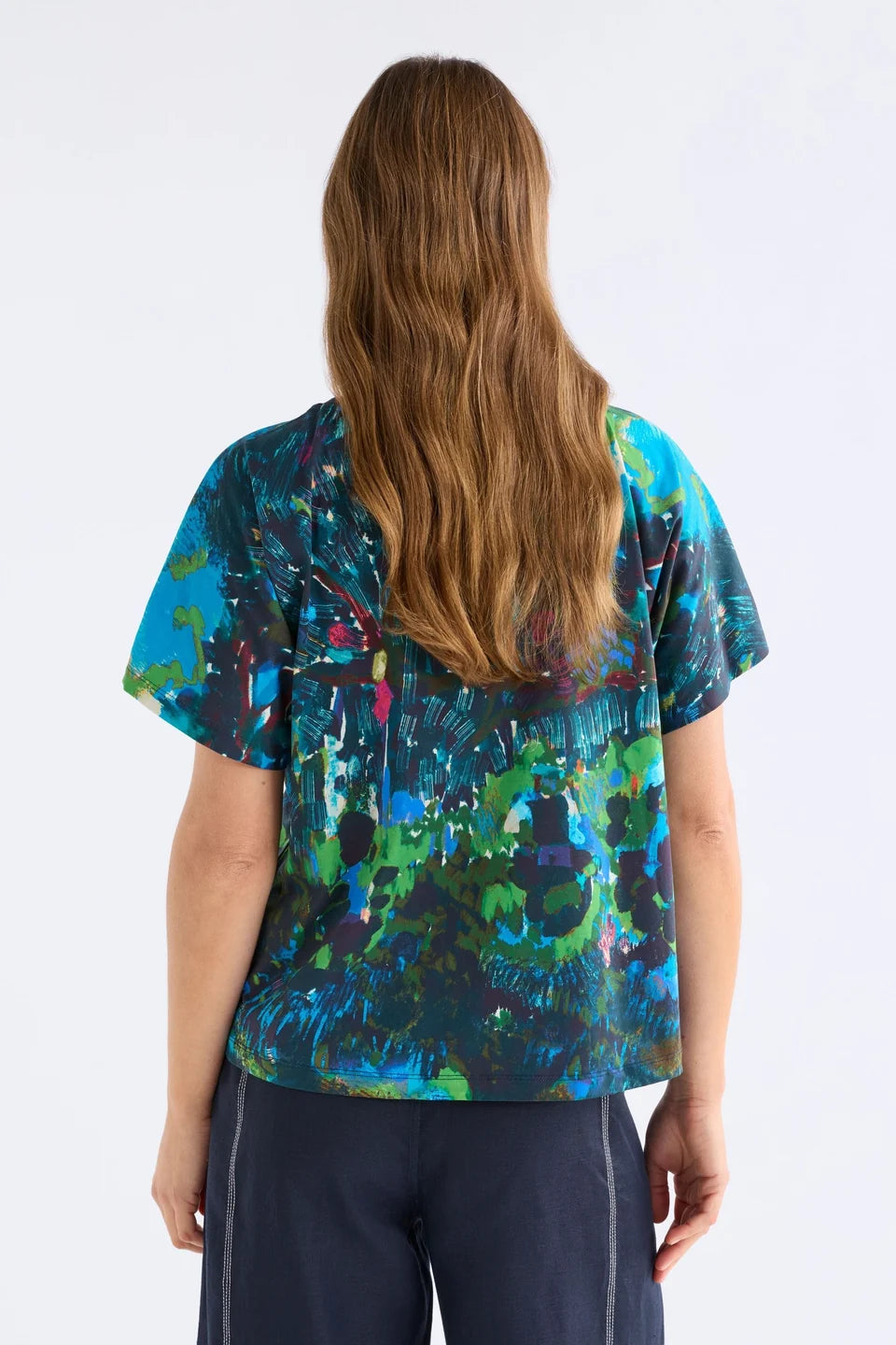 ELk Haki short sleeve print t-shirt in blue, green, and pink abstract.