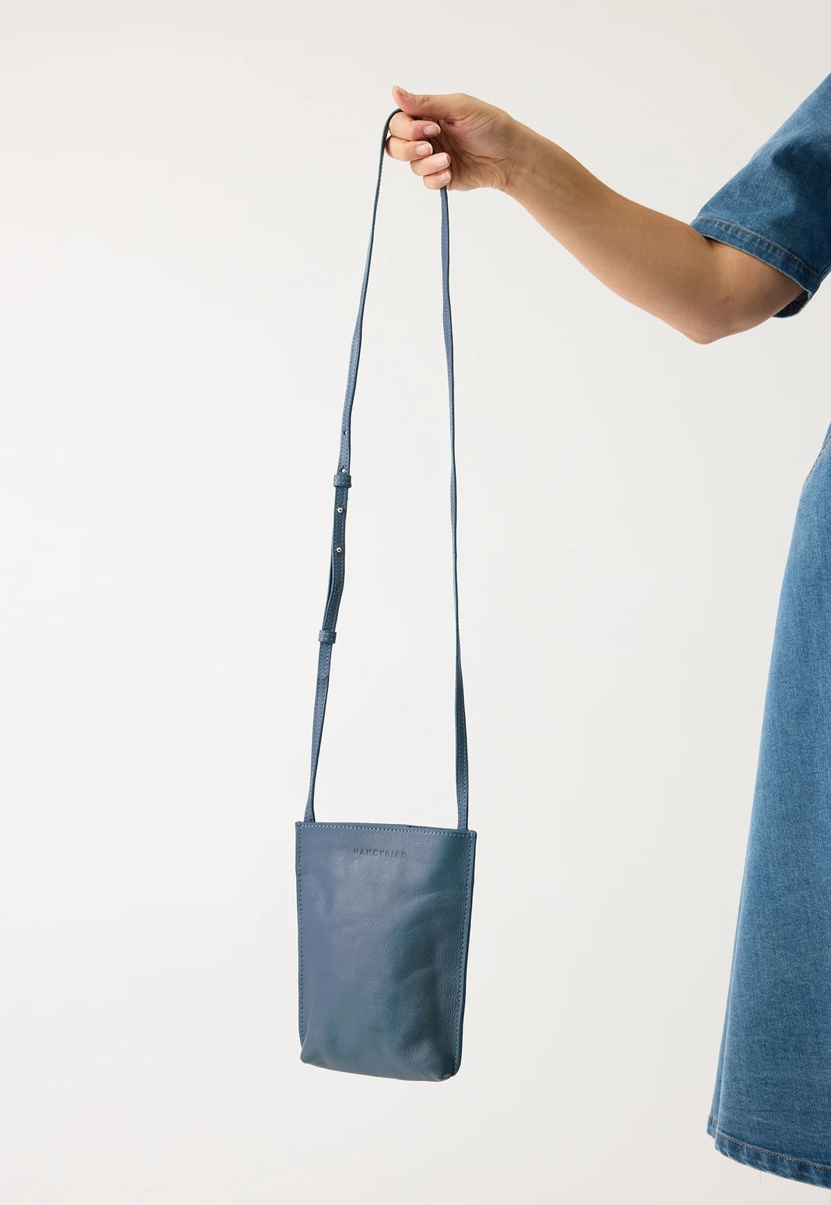 Nancybird Louanne pouch in vegetable tanned leather cross body mineral blue.