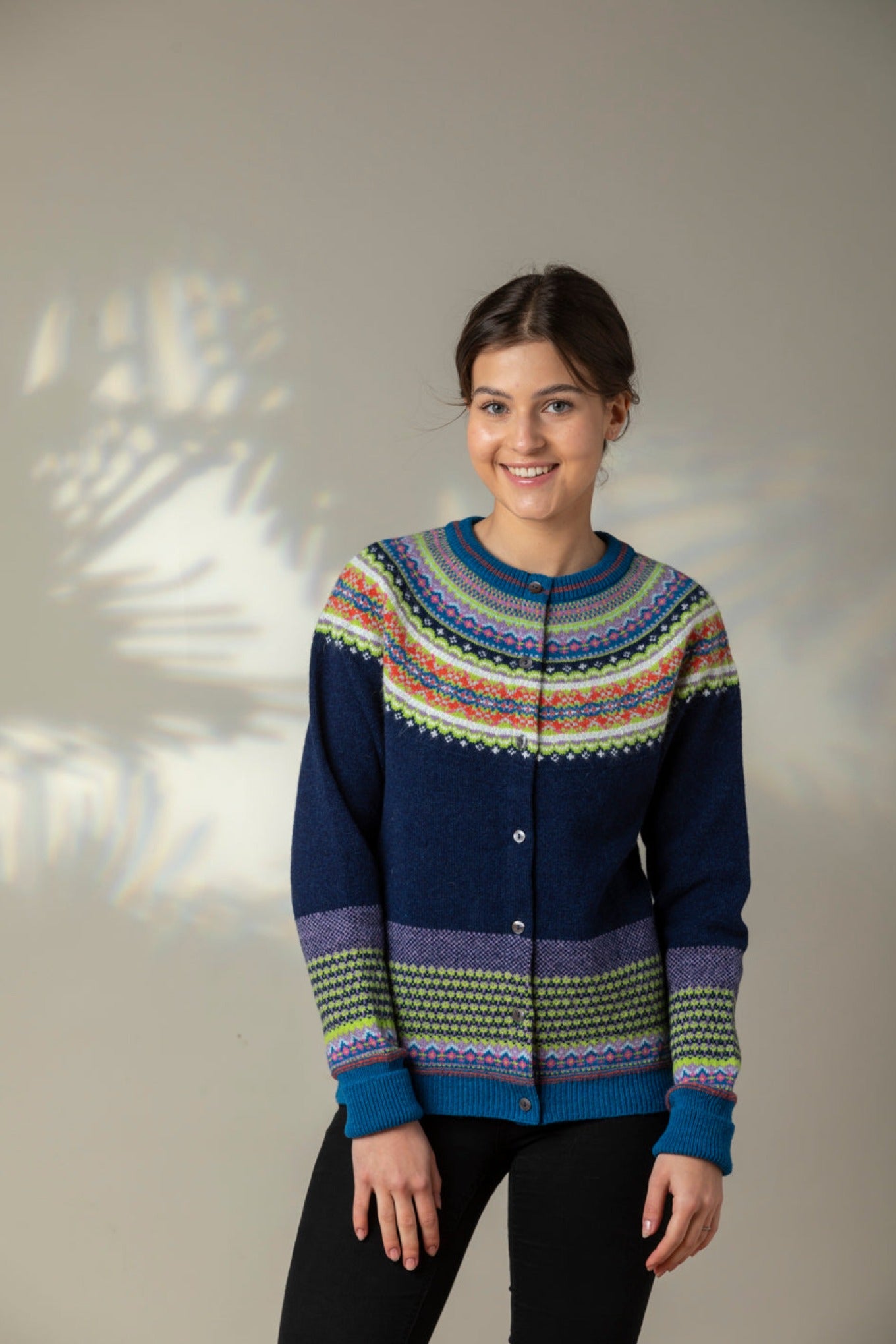 Eribe Scottish fairisle Alpine cardigan in Aurora, navy with fairisle in lime, sapphire blue and orange.
