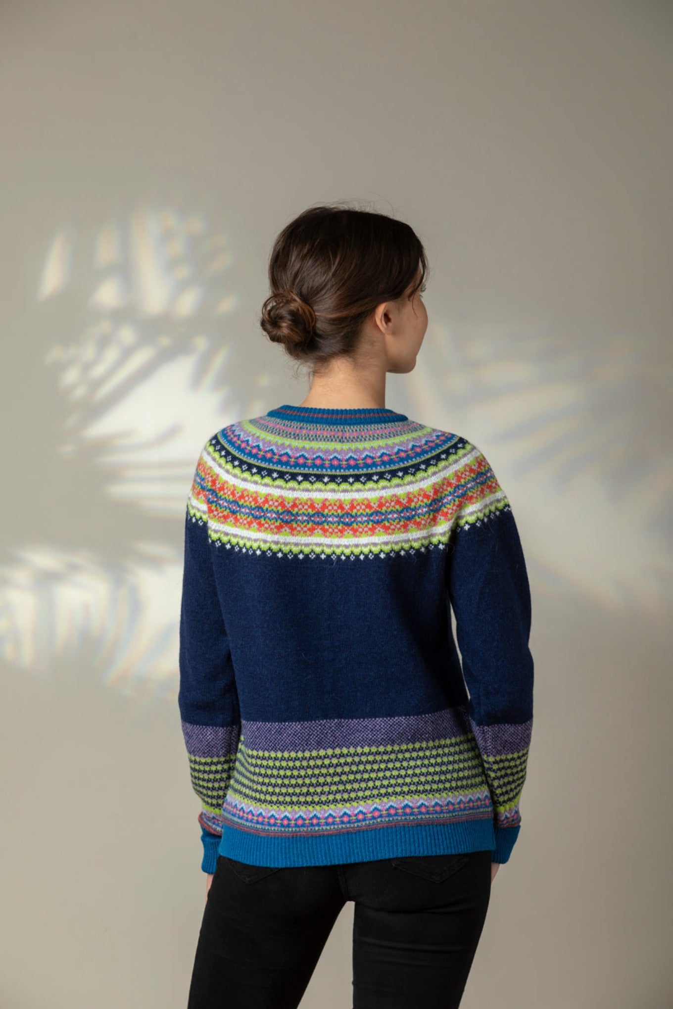 Eribe Scottish fairisle Alpine cardigan in Aurora, navy with fairisle in lime, sapphire blue and orange.