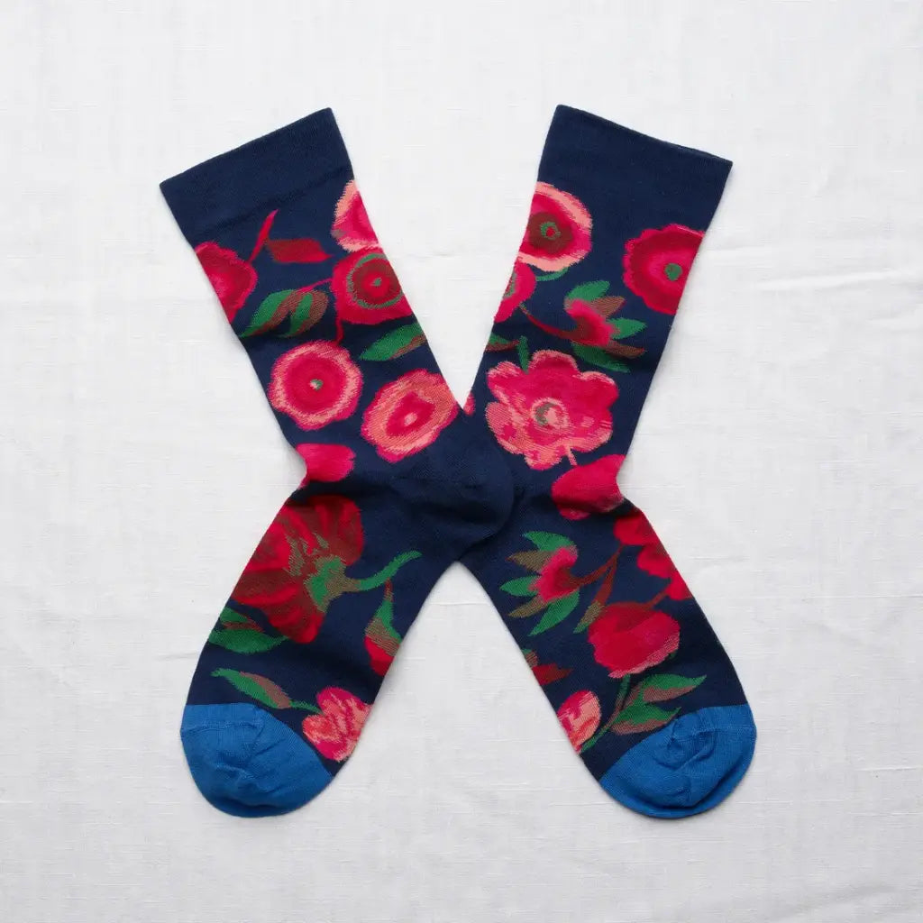 Bonne Maison made in France cotton socks featuring pink flowers on a navy blue base.